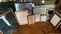 Group shot of all framed pieces leaning against wall