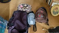 All four bags displayed on floor