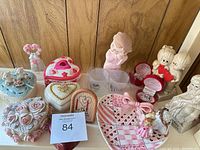 Overall lot view of trinket boxes, figurines, plate and plaque