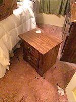 Front angled view showing drawers and brass pulls