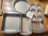 All five baking pans arranged to display size and types