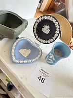All four jasperware pieces grouped on shelf