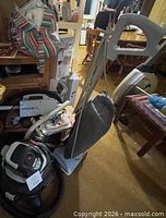 Oreck upright vacuum, Shop-Vac canister vacuum and accessories overall view