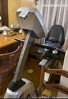 Full view of Horizon recumbent bike showing frame, seat, handlebars and attached hand weights