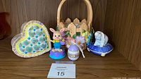 group shot of five porcelain Easter items on shelf