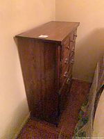 Right side view showing brown stained solid wood construction and height