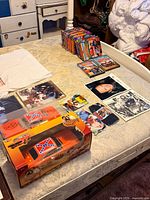 Overall view with boxed die-cast car, media, photos and T-shirt