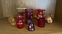 Group shot of all eight glass items on shelf
