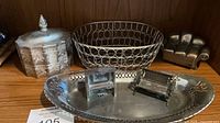 Group shot showing all six silver-plated items on shelf