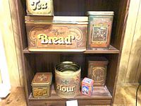 Shelf with all seven tins displayed