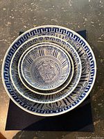 Nested view of four bowls showing size gradation and pattern