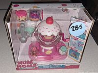 Front of boxed Num Noms Shimmer Playset showing contents