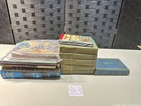 Stack of 14 assorted antique hardcover books including green John Fox Jr. set and other titles