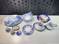 Overall view of all blue & white and floral items on table