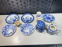 Group shot of all blue and white transferware items on table