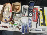 Overview of lot showing tools, fittings and dial indicator