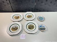 Five plates visible: four Lord Nelson Pottery game bird plates and one souvenir plate