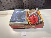 Overall box view showing assorted tools and suction lifter package