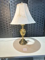 Full view of lamp with shade showing overall form and finish