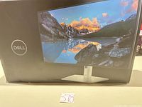 Front of Dell UltraSharp U2424H retail box showing monitor image