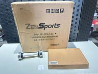 Sealed ZenSports gym mat box, shake weight dumbbell, closed BodyGym box