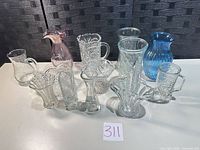 Group shot of all 13 glass pieces showing variety and relative sizes