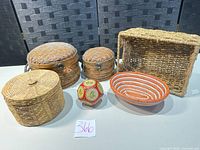 Group shot showing all six baskets and zodiac paperweight