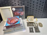 Entire lot group showing shadow box, packaged nesting gift boxes, two craft storage boxes, ornate switch plates