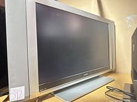 Front view of Magnavox 37" LCD TV on stand