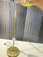 Full view of brass floor lamp showing height, pole, shade and cord