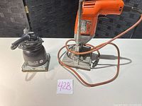 Overall view of drill on stand and sander