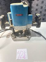 Front view of Ryobi plunge router with cord visible