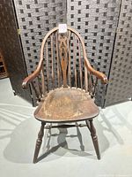 Front view of Windsor armchair showing overall design and wear