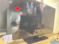 Front view of VIZIO 39-inch TV on stand