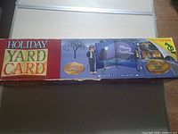 Front of Gemmy Holiday Yard Card box showing contents and size