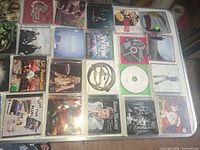 First overhead shot of 20 CDs showing pop, rock and gospel titles in cases