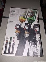 Front of retail box showing 3-station drink dispenser image