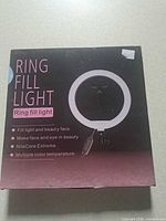 Front of box showing product name and image of ring light with in-line control