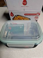 Container with lid inside box
