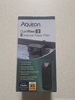 Front of sealed retail box showing Aqueon QuietFlow 3E filter