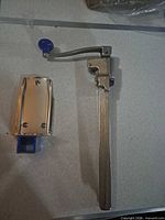 Full view of can opener arm and separate mounting base