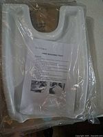 Front view of Bluestone hair washing tray in clear packaging with instruction sheet