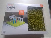 Front of boxed Boon LAWN drying rack showing product image