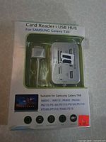 Front of sealed package showing hub and adapter cable