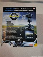 Front of boxed DashCam Pro showing product image and features