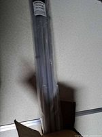 Sealed package containing curtain rods
