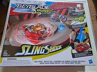 Front of retail box displaying Beyblade Burst Turbo Slingshock Rail Rush Battle Set