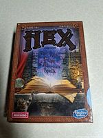 Front of sealed Hex Casters box showing title, age range, player count
