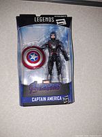 Front view of sealed Captain America figure and shield in blister.