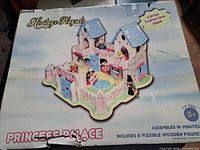 Front of original box showing illustrated assembled castle and branding